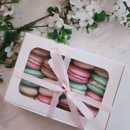 A box filled with colorful macaroons