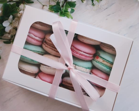 A box filled with colorful macaroons.